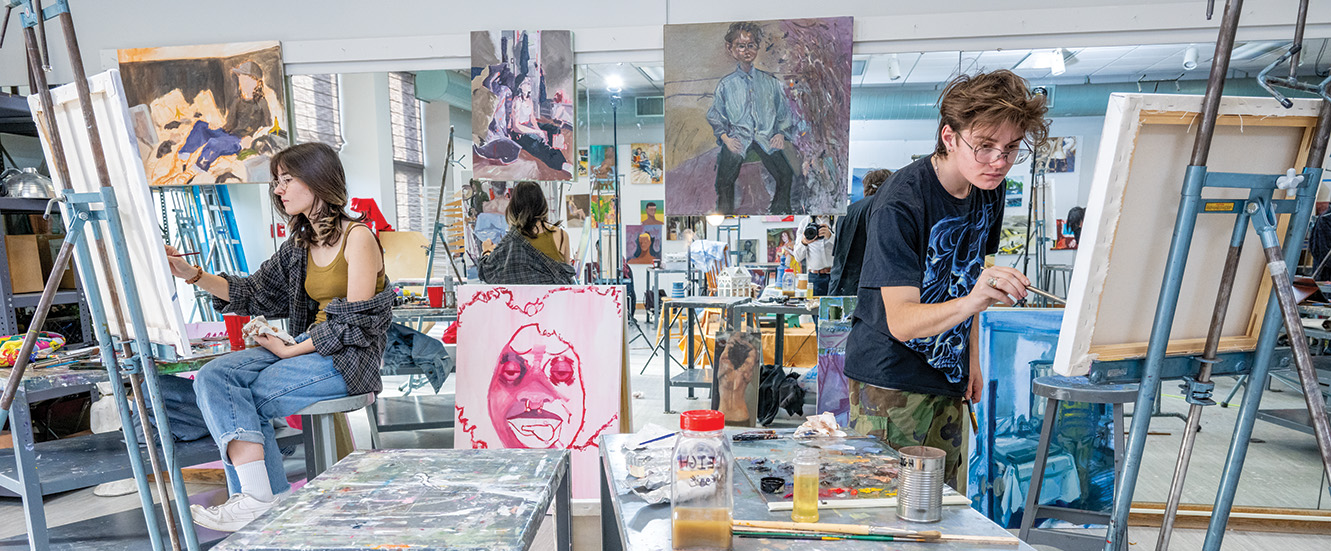 students painting in the studio