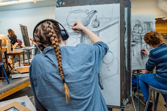 student drawing in class