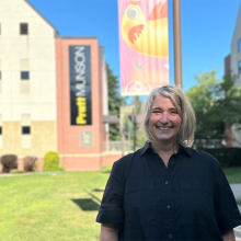 Photo of Suzanne in front of College